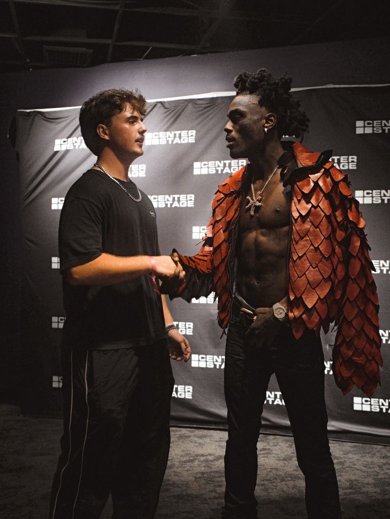 MAYO shaking hands with an artist backstage at Center Stage